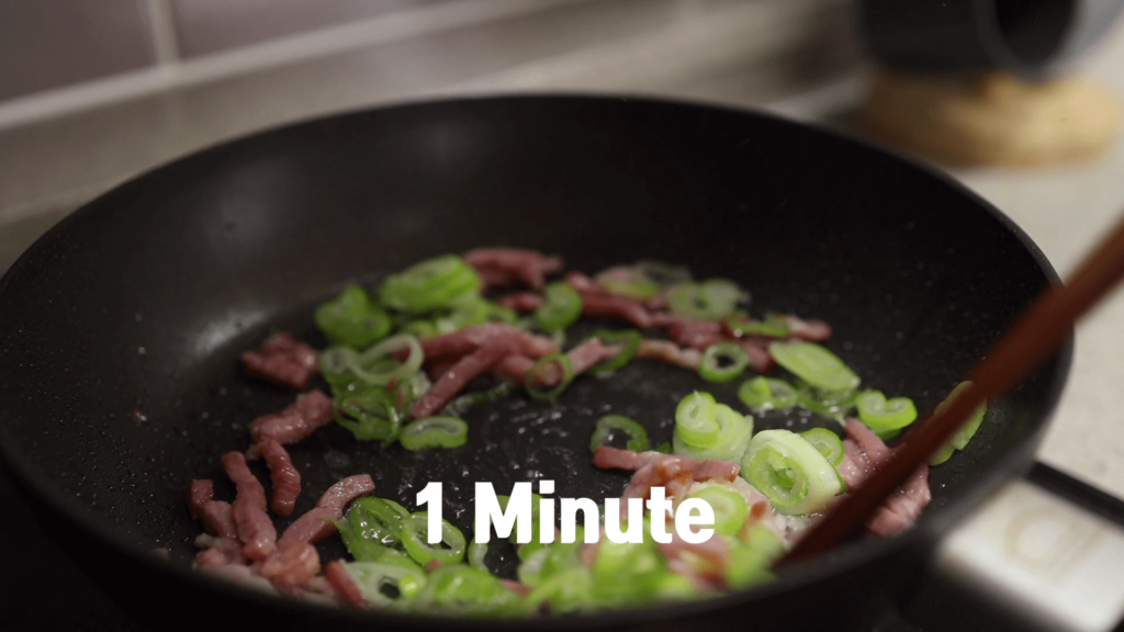 Cook bacon with green onion