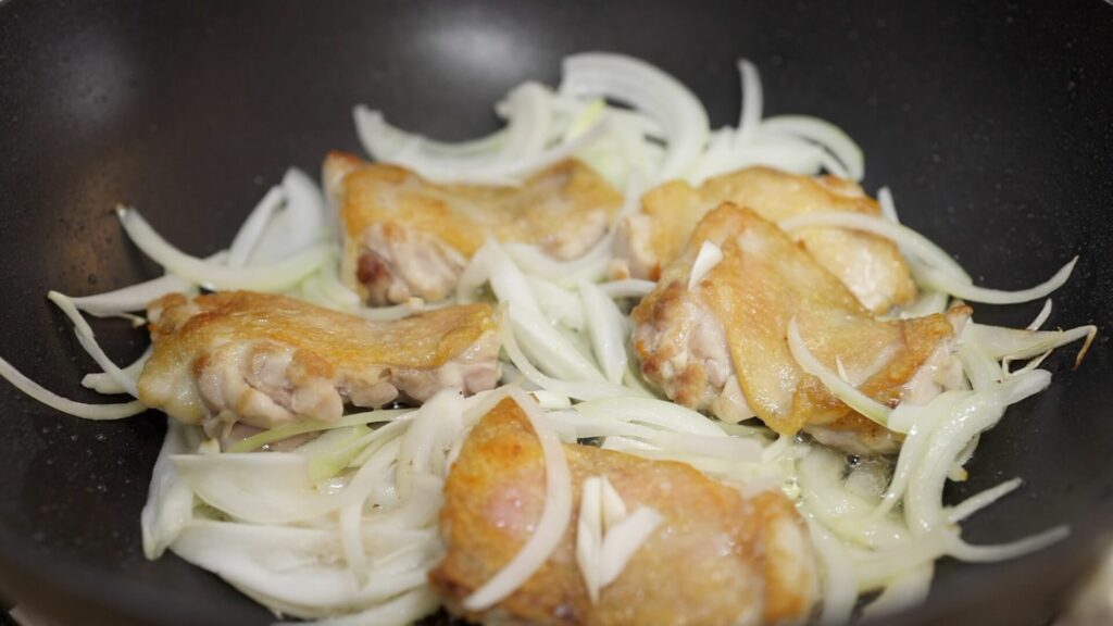 Cook chicken and onion in a pan