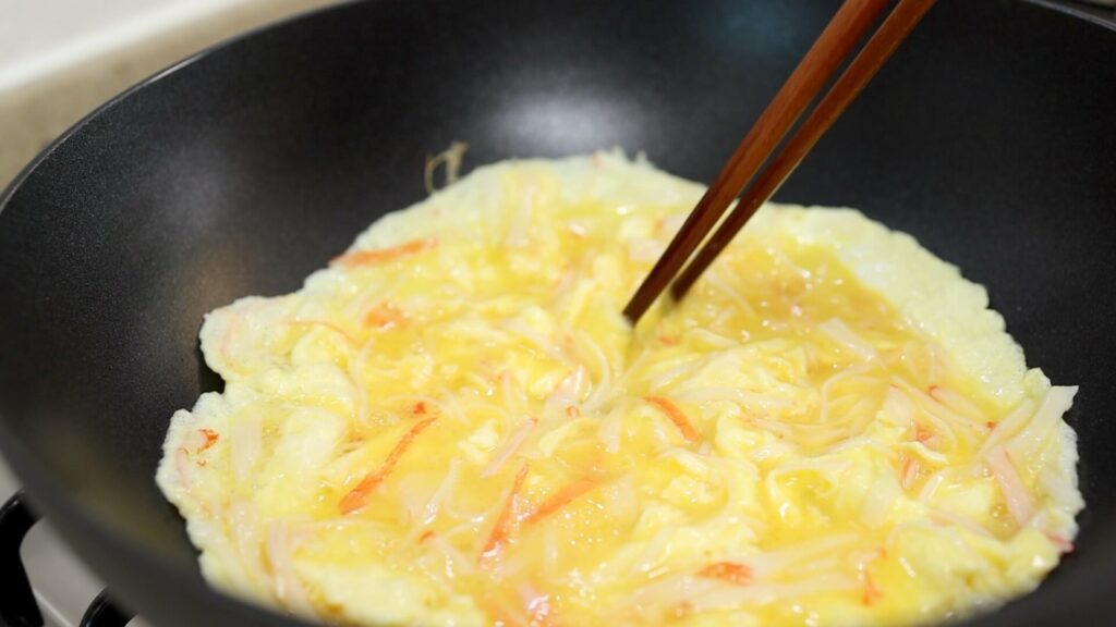 Make crab meat omelette in a pan
