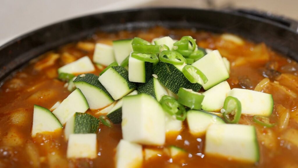 Add the zucchini and chili to the gochujang stew