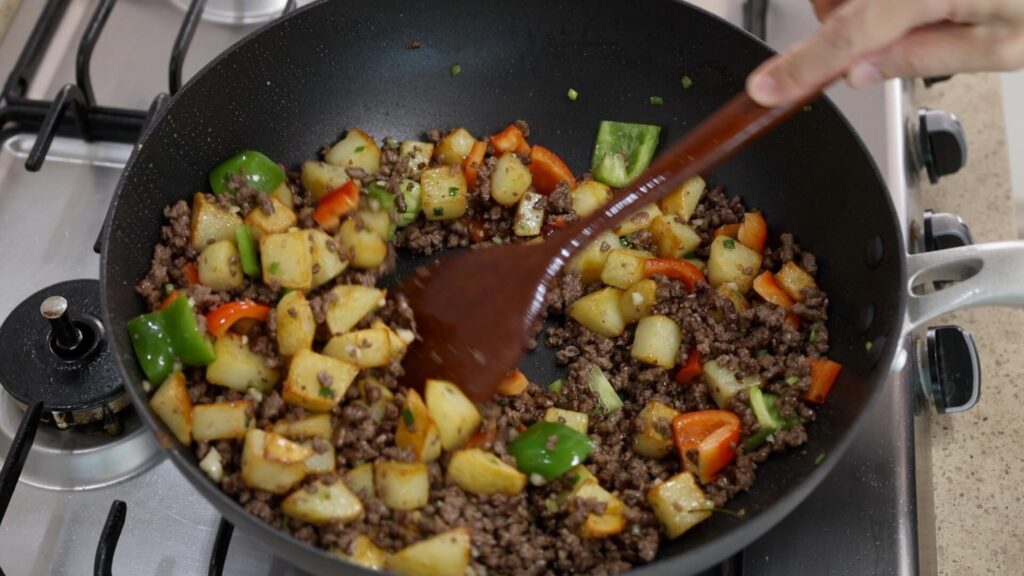 Ground Beef and Potato Stir-Fry in a Wok