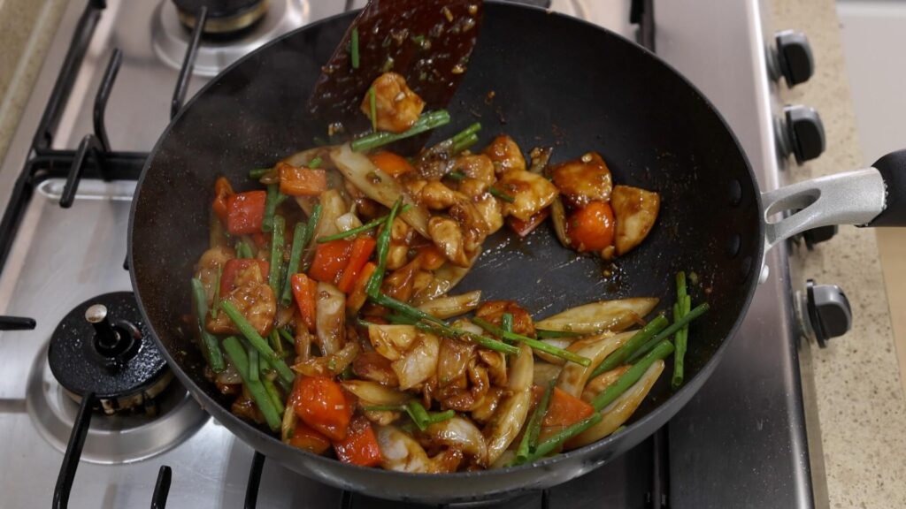 Chicken and Onion Stir-Fry in a Wok